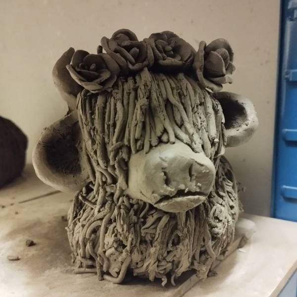 Clay Highland Cow with a curly topknot