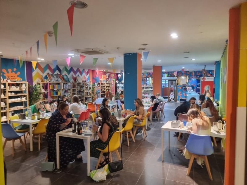 Guests at tables during a party in the Pictura café
